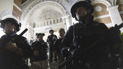 University of California Police officers face pro-Palestinian protesters outside Dodd Hall in the University of California Los Angeles (UCLA) in Los Angeles, June 10, 2024. Several protesters were arrested by UCLA police following a new attempt to set up an encampment on the University campus. (Photo by ETIENNE LAURENT / AFP) (Photo by ETIENNE LAURENT/AFP via Getty Images)